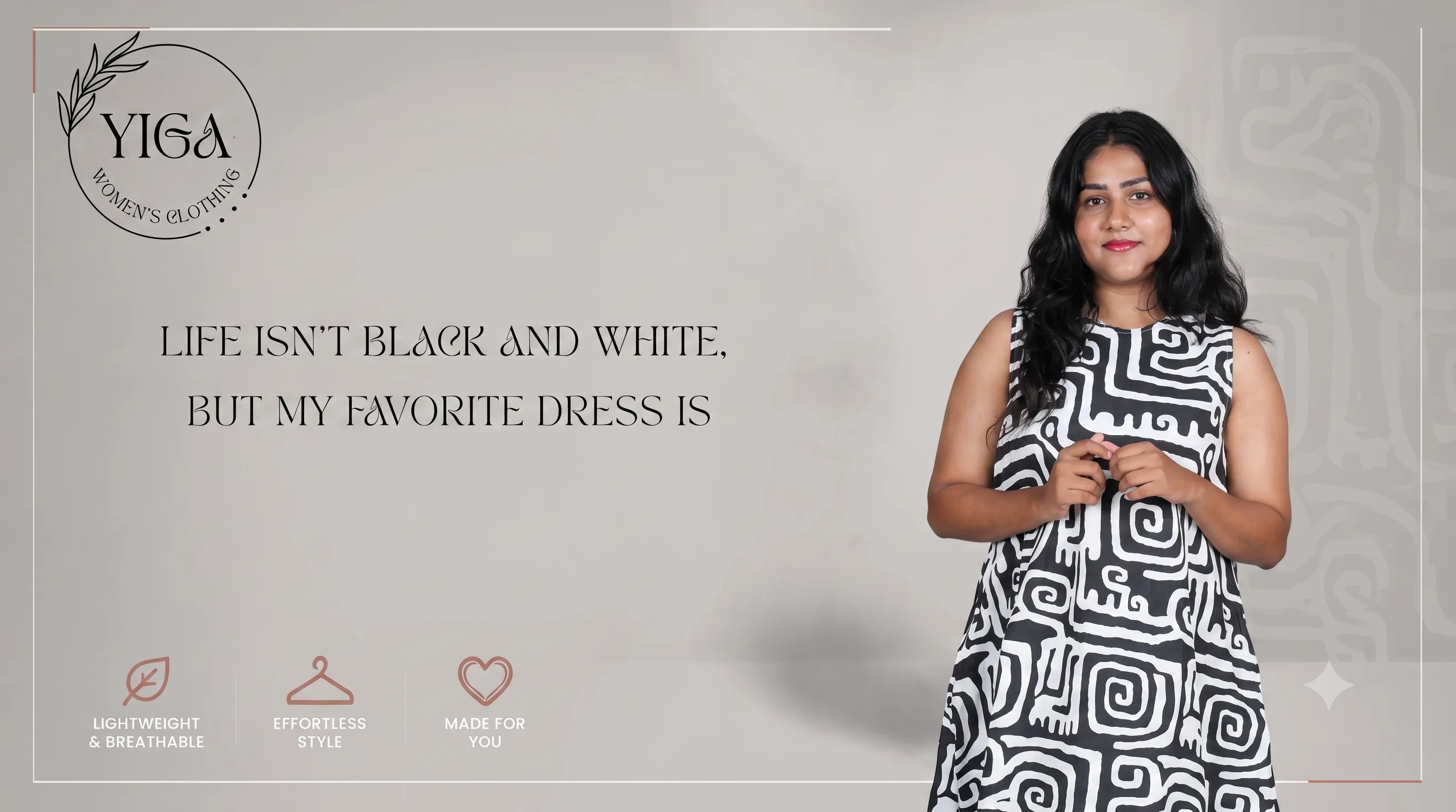 Model wearing a black and white YIGA dress